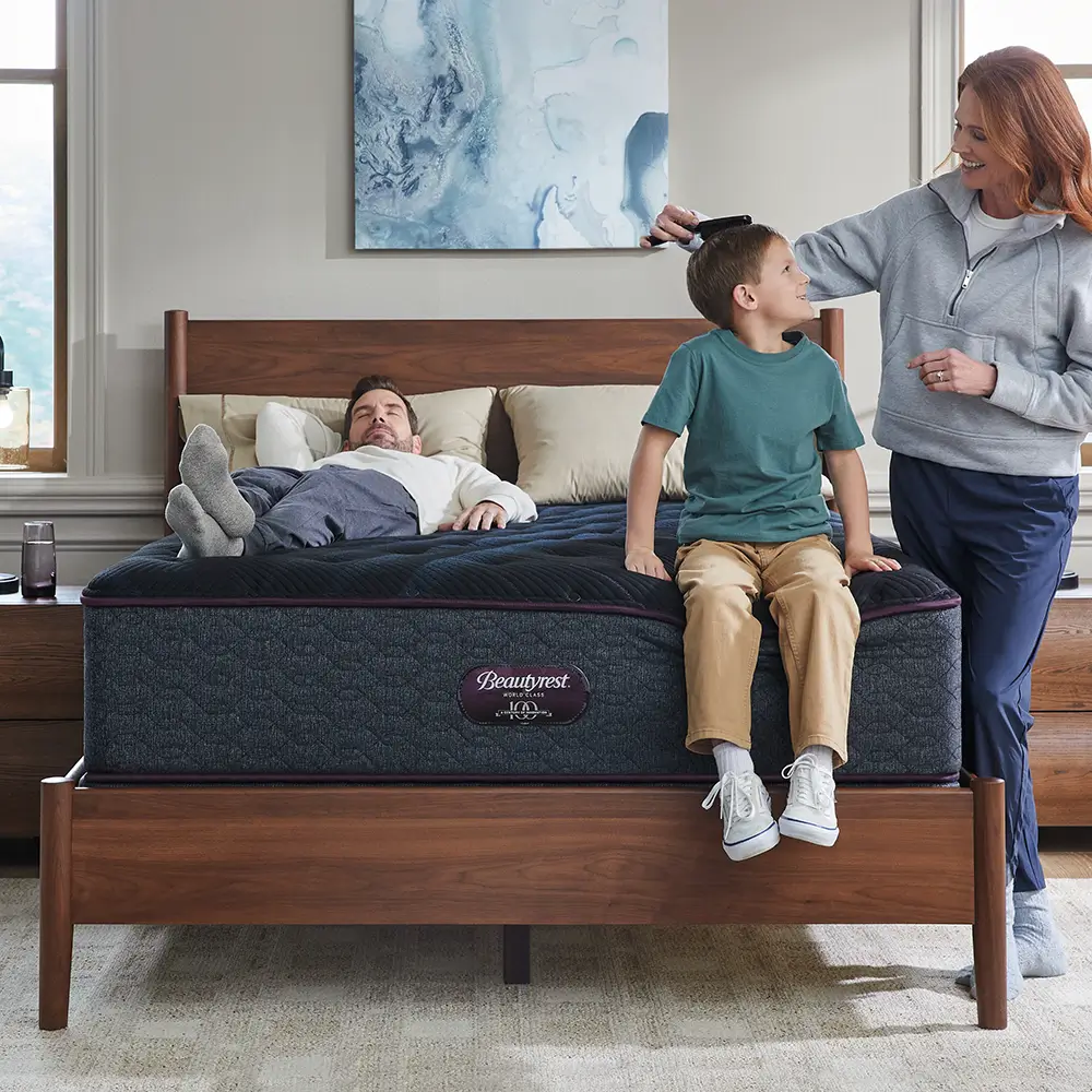 Mother brushing son's hair on a Beautyrest mattress