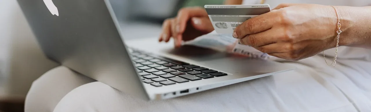 Woman purchasing something on computer