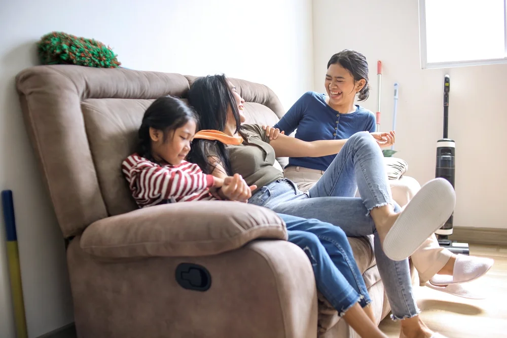 Family having fun in a sofa