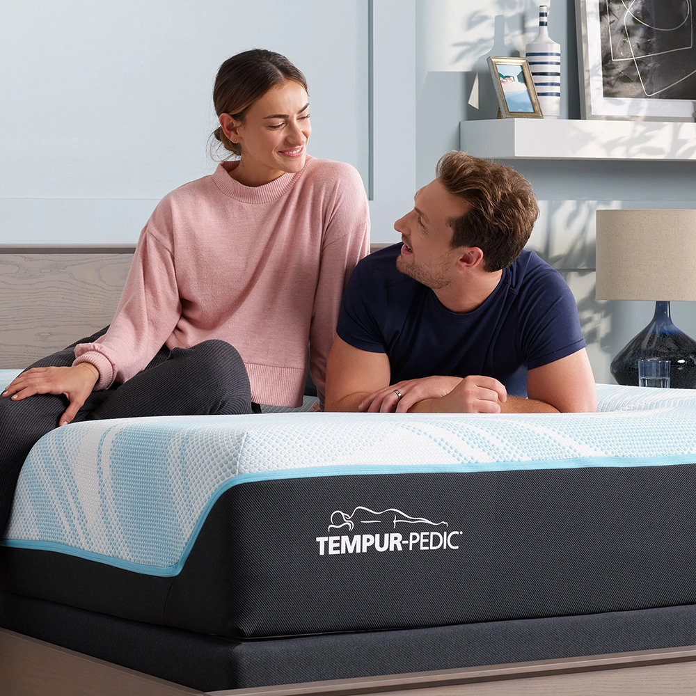 Happy couple on a mattress